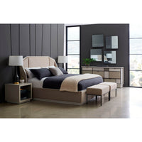 Chic bedroom setup with two benches, large windows.