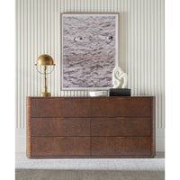 Decor styled on six-drawer dresser with artwork above.
