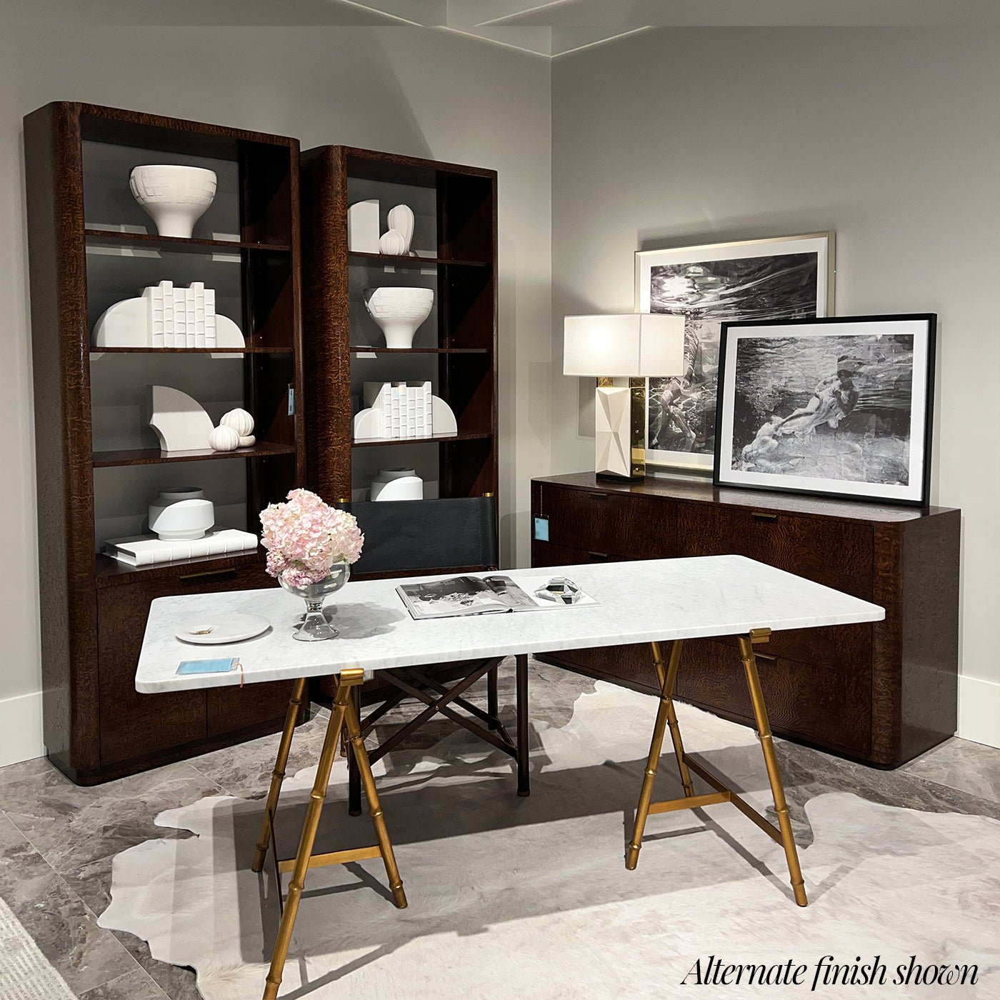 Room setup with black art deco dresser and modern decor.