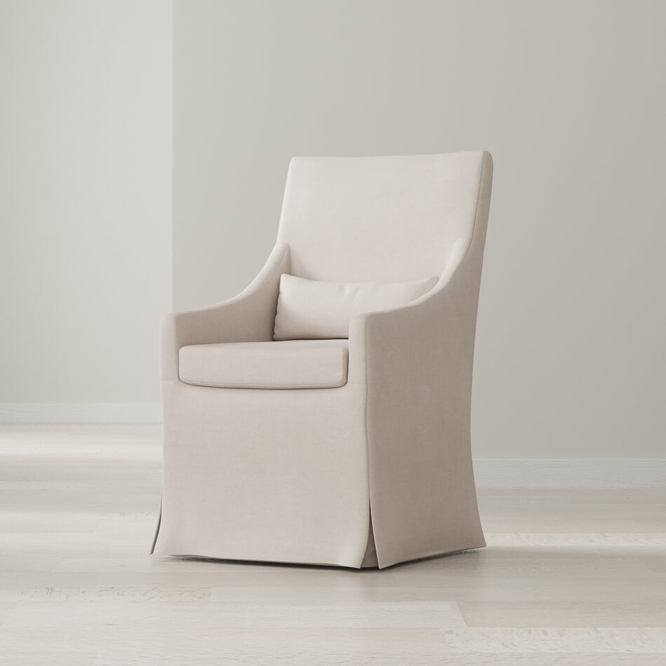Beige skirted dining chair in bright room setting