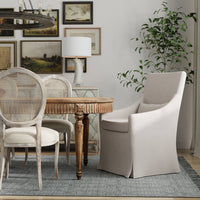 Beige skirted dining chair in decorated dining room