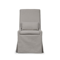Slipcovered dining chair front detailed view with cushion.