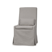 Slipcovered dining chair front view with cushion.