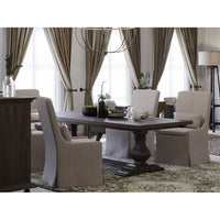 Slipcovered dining chairs in elegant dining room setting.