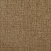 Fabric texture detail of slipcovered dining chair upholstery.
