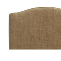 Upper back detail of slipcovered dining chair.
