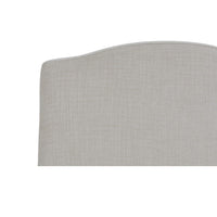 Close-up slipcovered dining chair top, light beige upholstery.