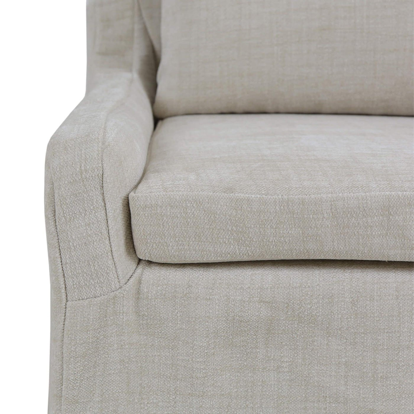 Armrest detail slipcovered dining chair, light beige upholstery.