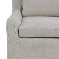 Armrest detail slipcovered dining chair, light beige upholstery.