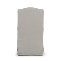 Back view slipcovered dining chair, light beige upholstery.
