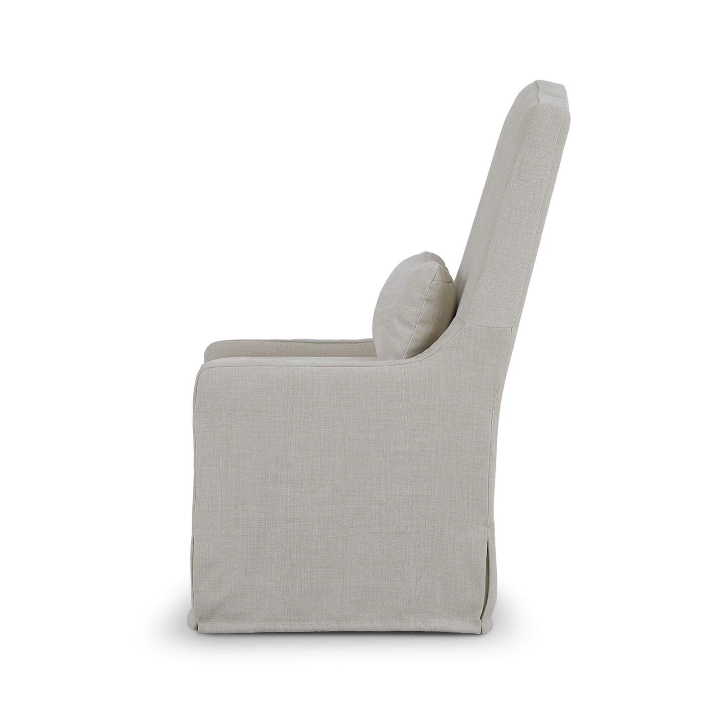Side profile slipcovered dining chair, light beige upholstery.
