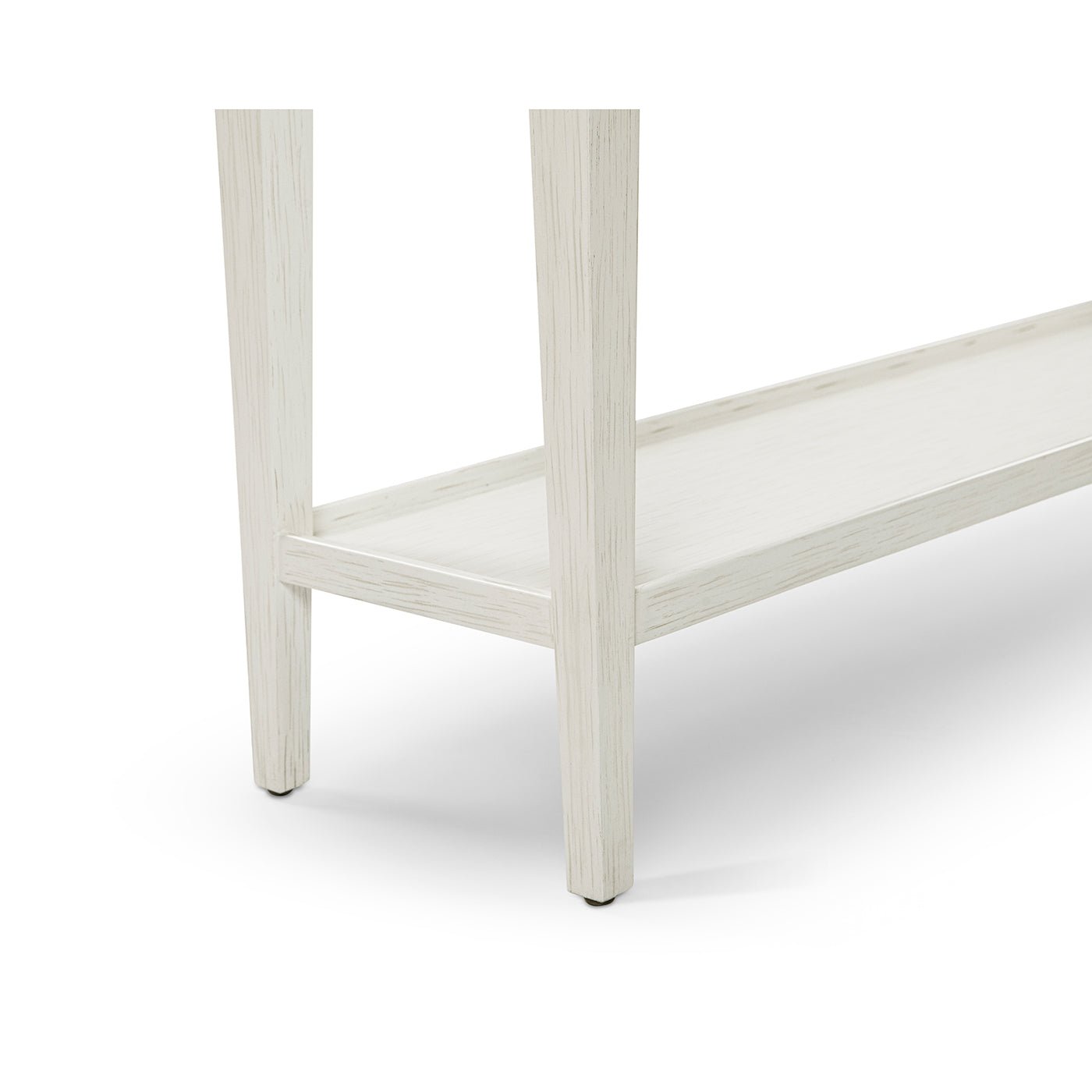 Leg and lower shelf detail, small white console table.