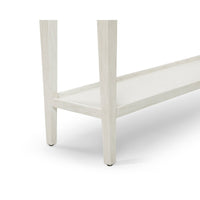 Leg and lower shelf detail, small white console table.