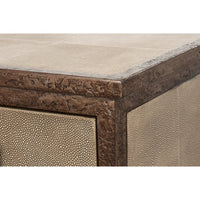 Close-up of sideboard corner, highlighting intricate wood detail.