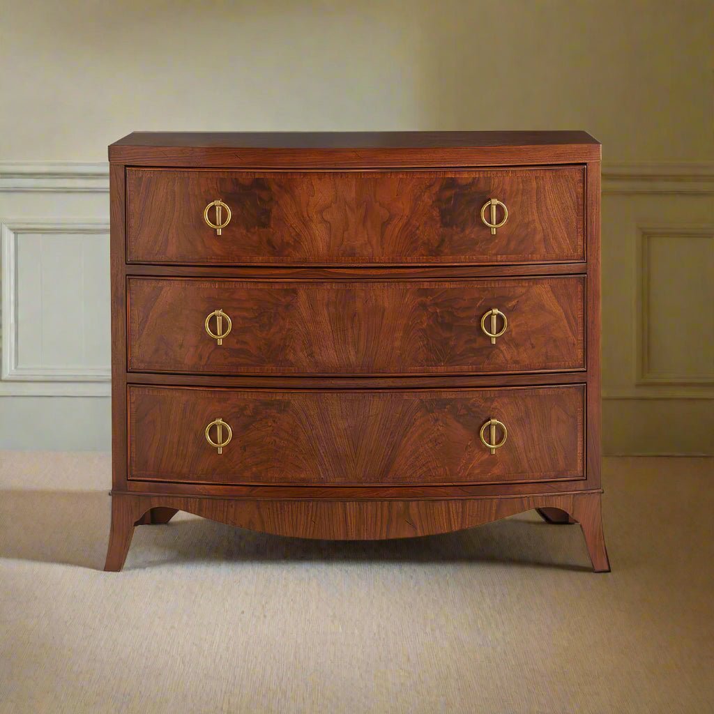 Walnut chest of drawers in elegant room setting.