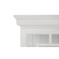 Close-up of white credenza's decorative top edge.