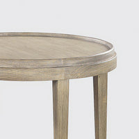 Close-up of wooden texture on round end table.