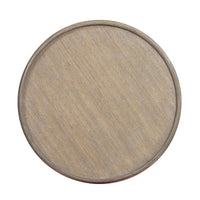 Top view of small greyed round end table surface.