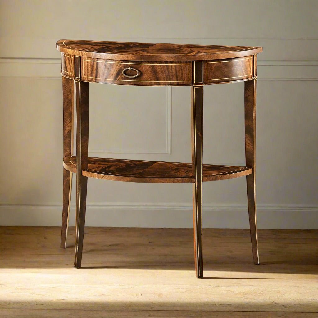 Small mahogany console table in a room setting.