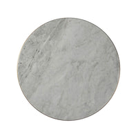 Top-down view, round marble surface of cocktail table.