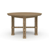 Round wood dining table, front view.