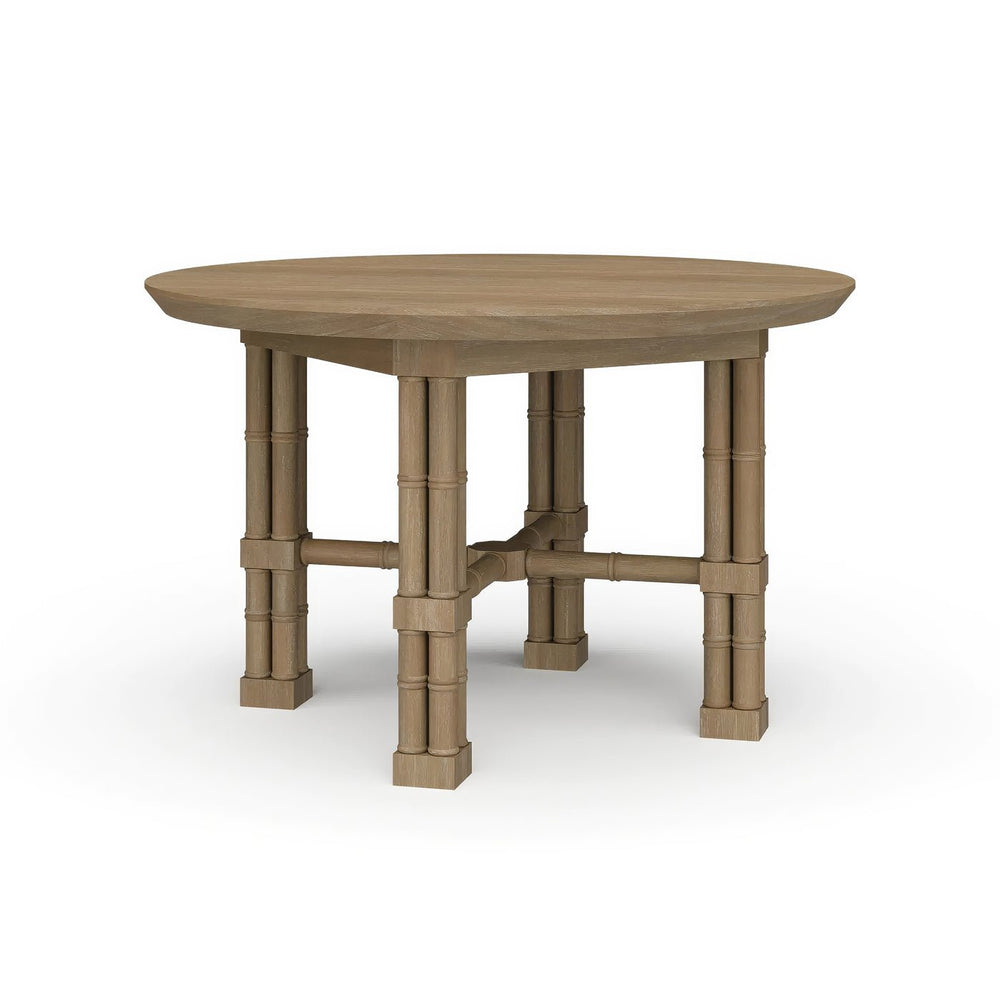 Round wood dining table, angled view.