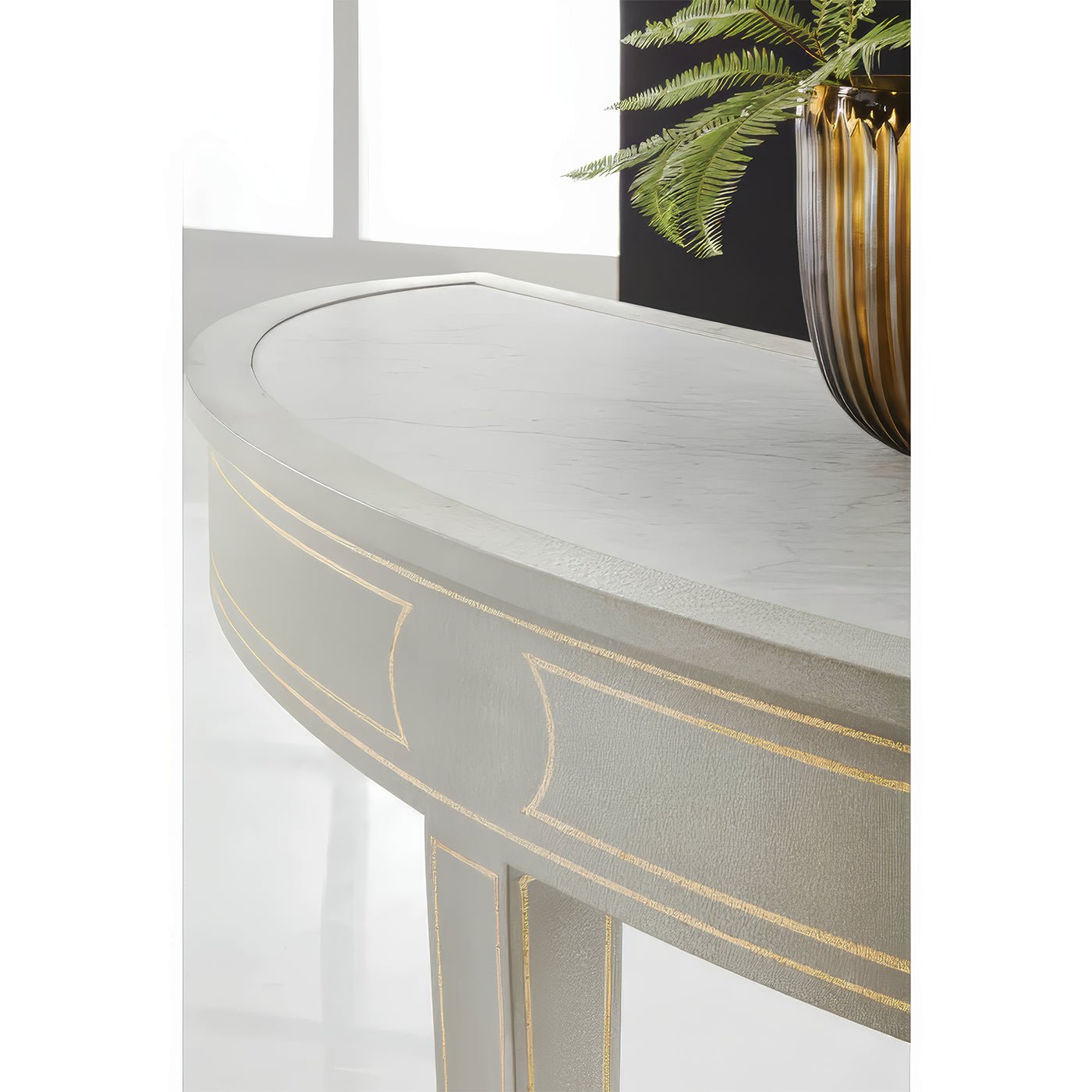 Console table corner with decorative vase on top.