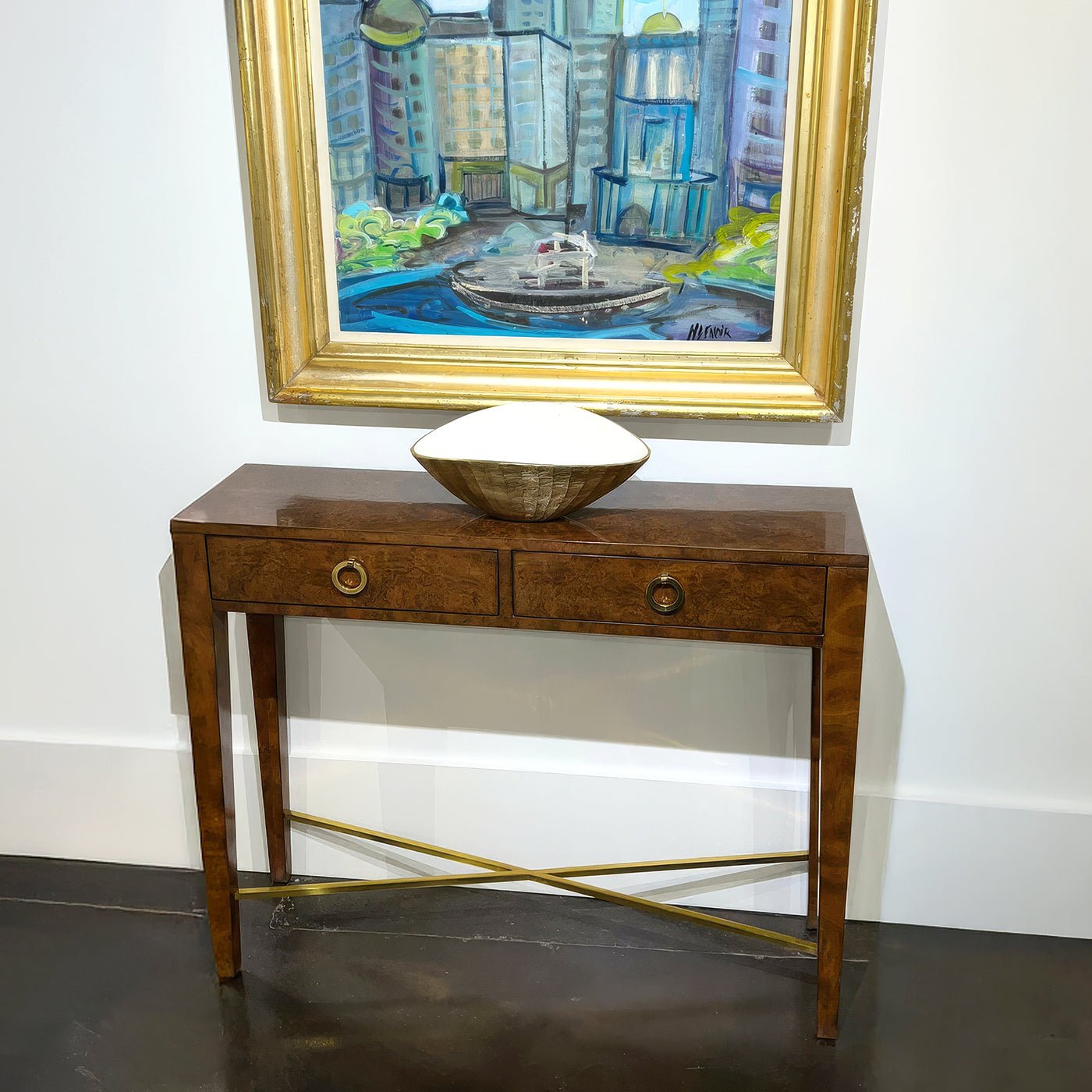 Console table with bowl and framed painting above