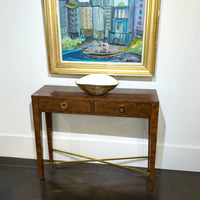 Console table with bowl and framed painting above