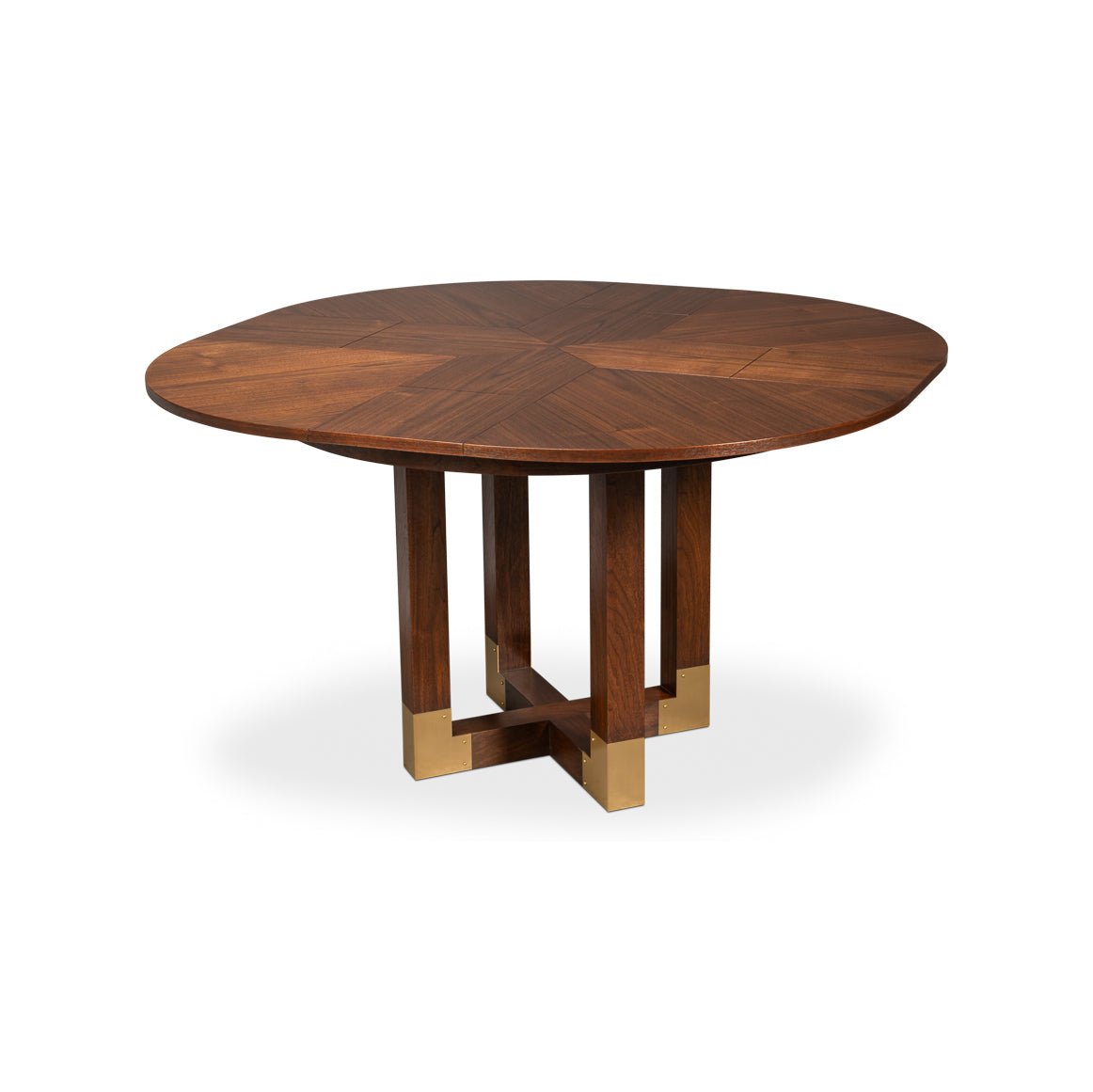 Dark wood dining table with round top and cross base.