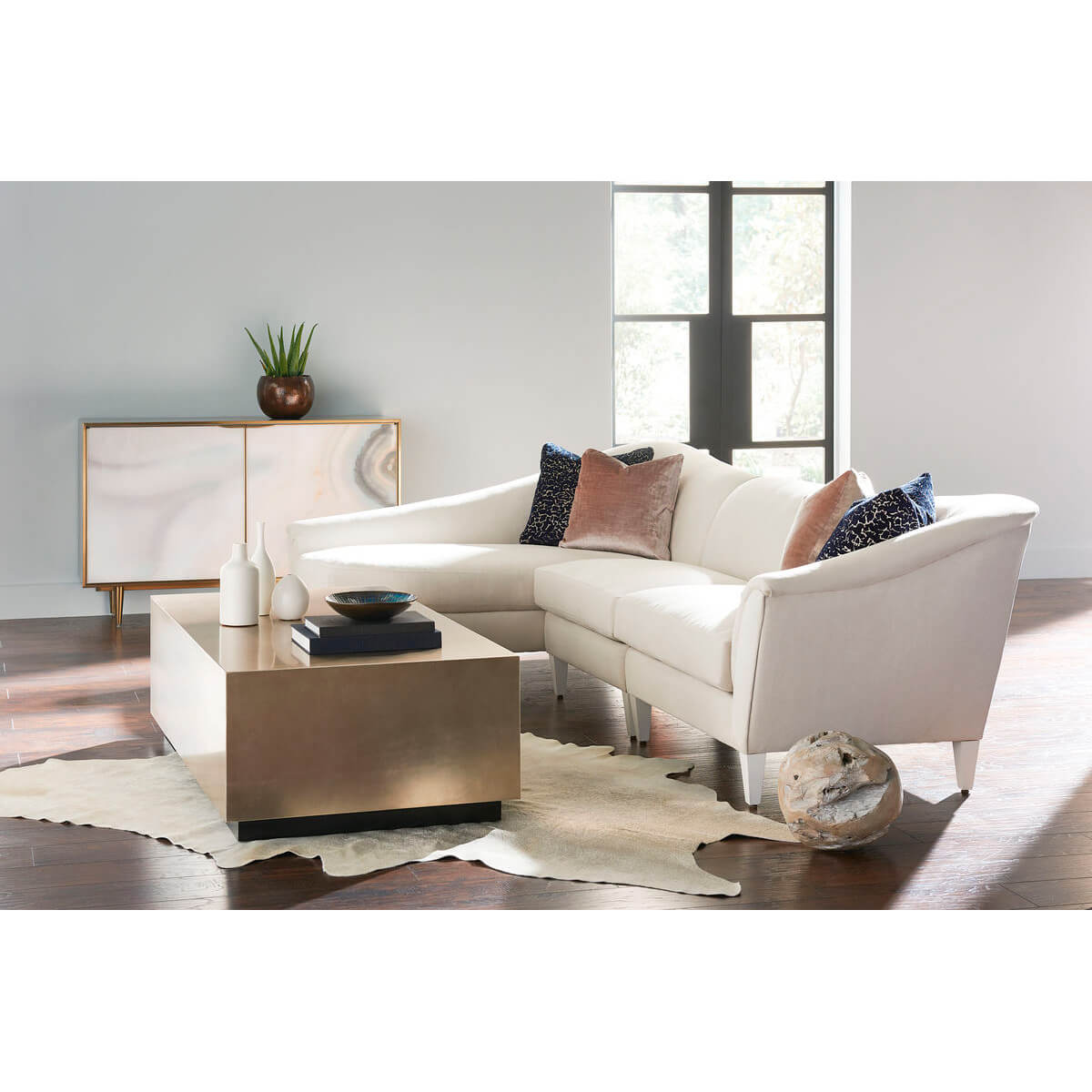 Modern living room with coffee table and sectional sofa.