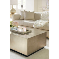 Coffee table with tray and candles in living room.