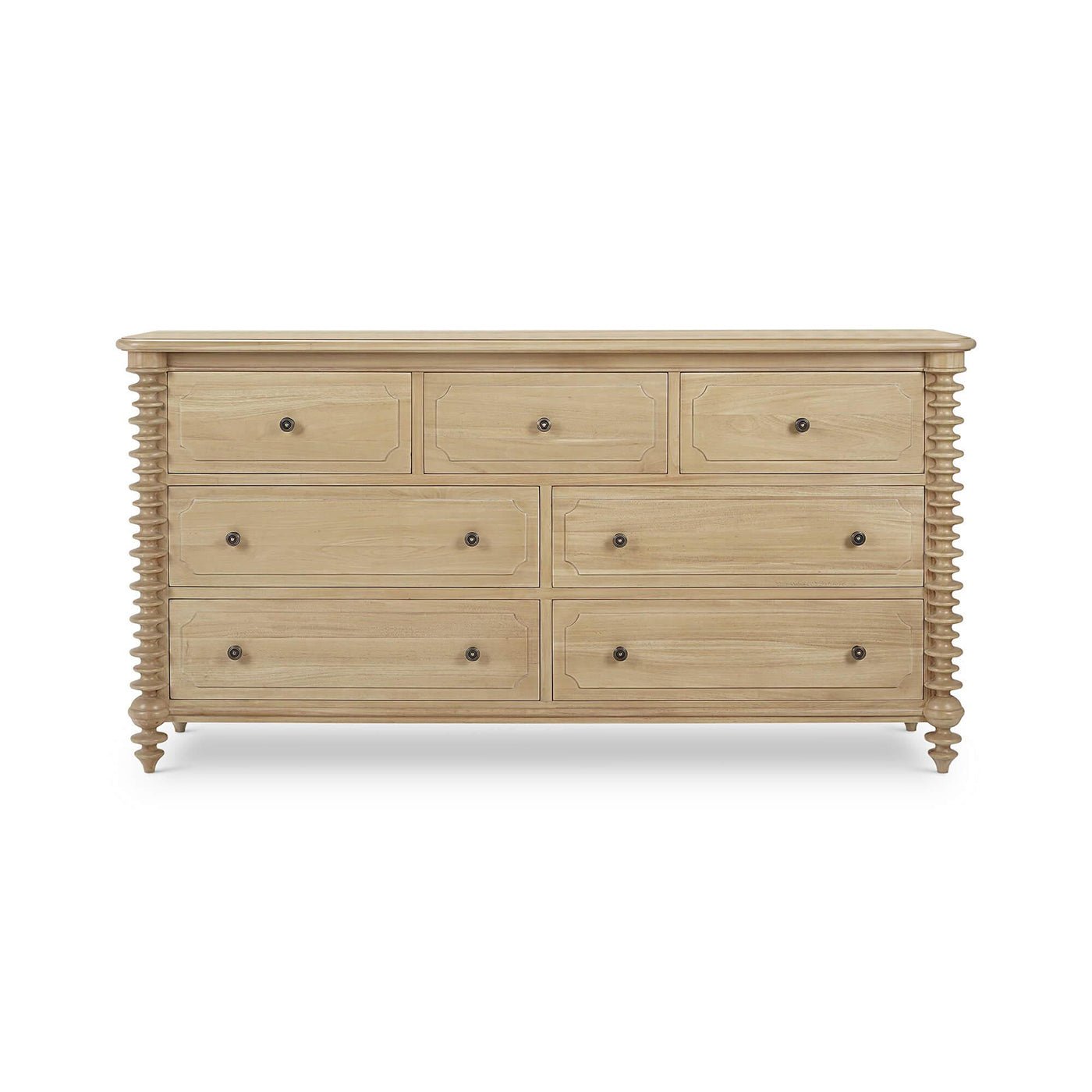 Light wood dresser with drawers closed.