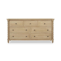 Light wood dresser with drawers closed.