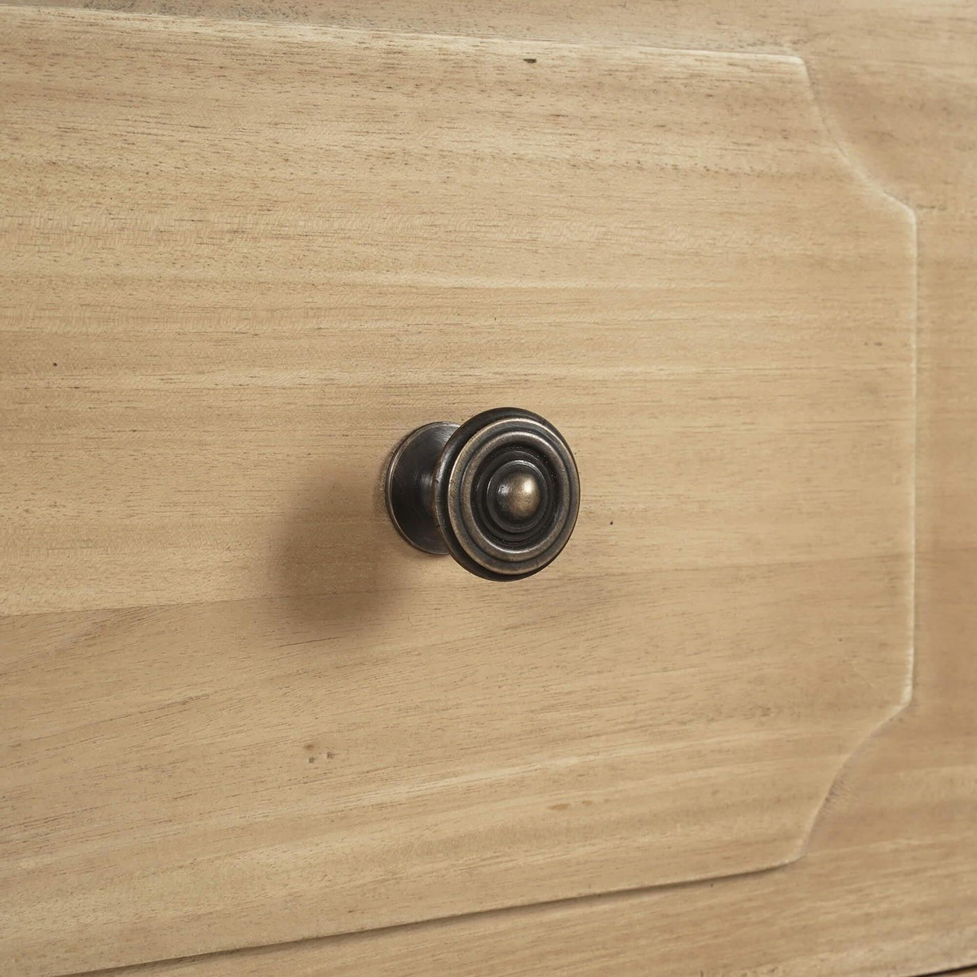 Close-up of dresser drawer knob.