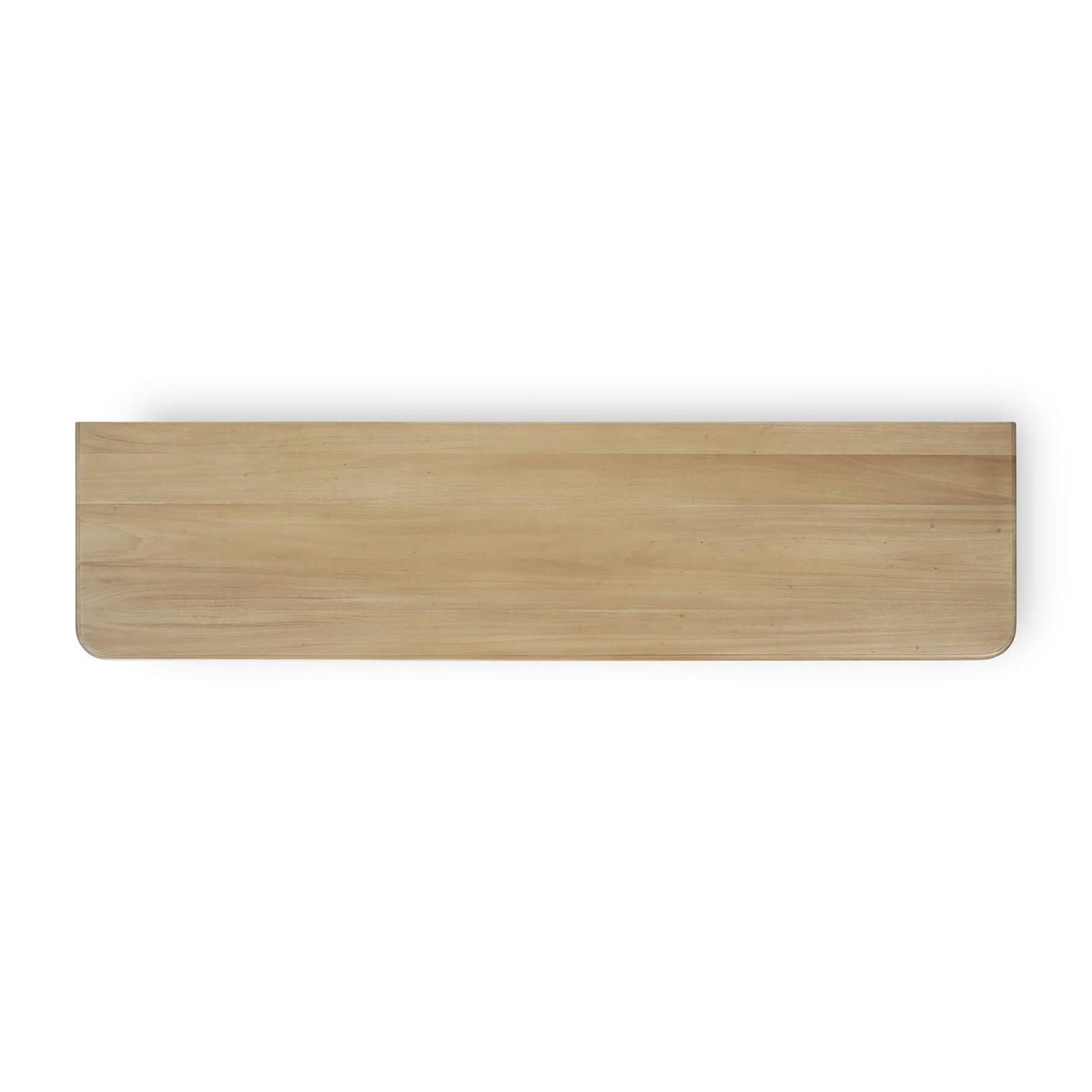 Top view of light wood dresser surface.