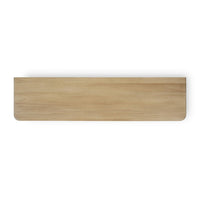 Top view of light wood dresser surface.
