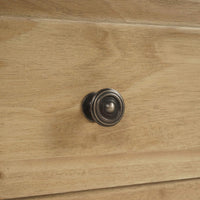 Close-up of spool-turned chest drawer knob.