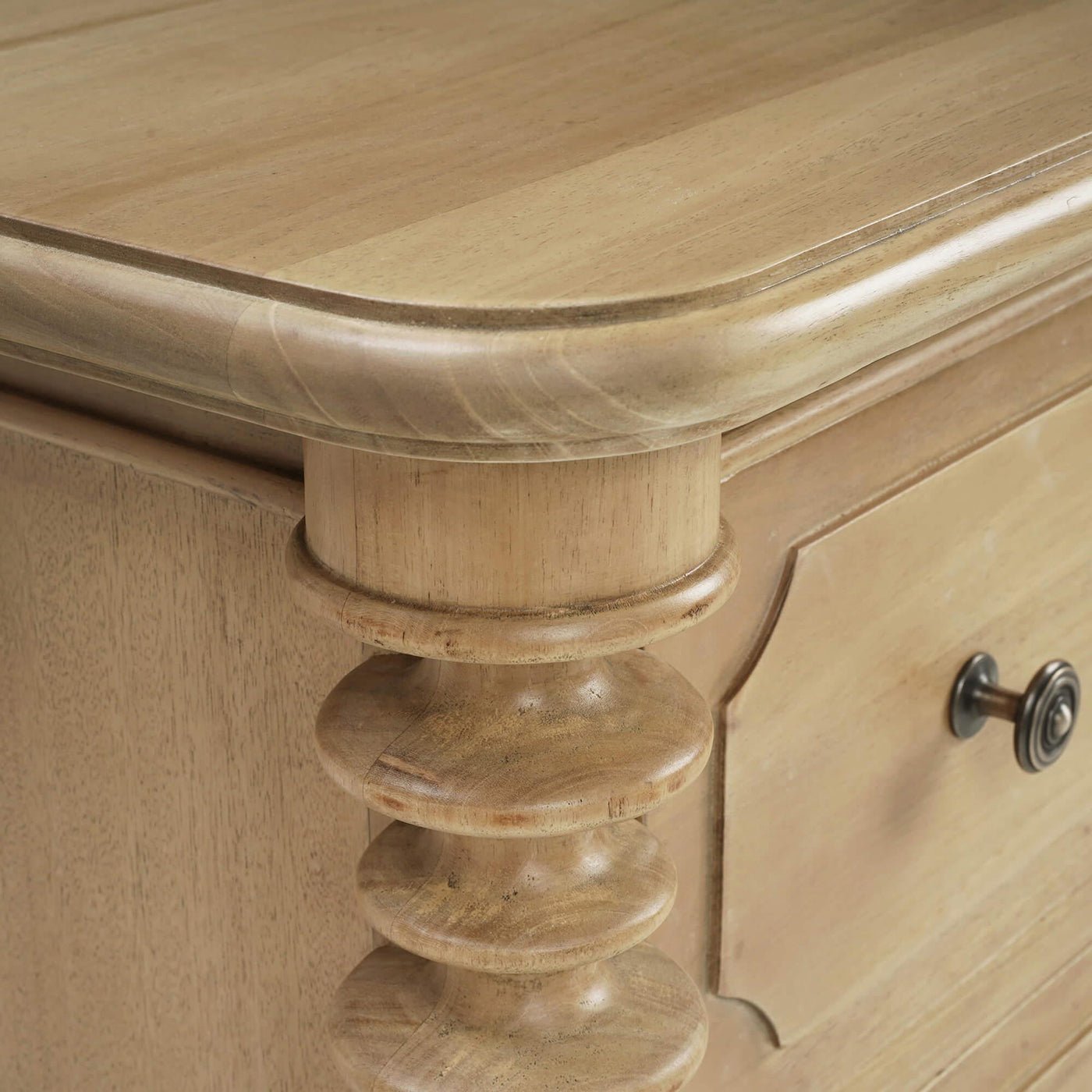 Detailed view of spool-turned chest corner and edge.