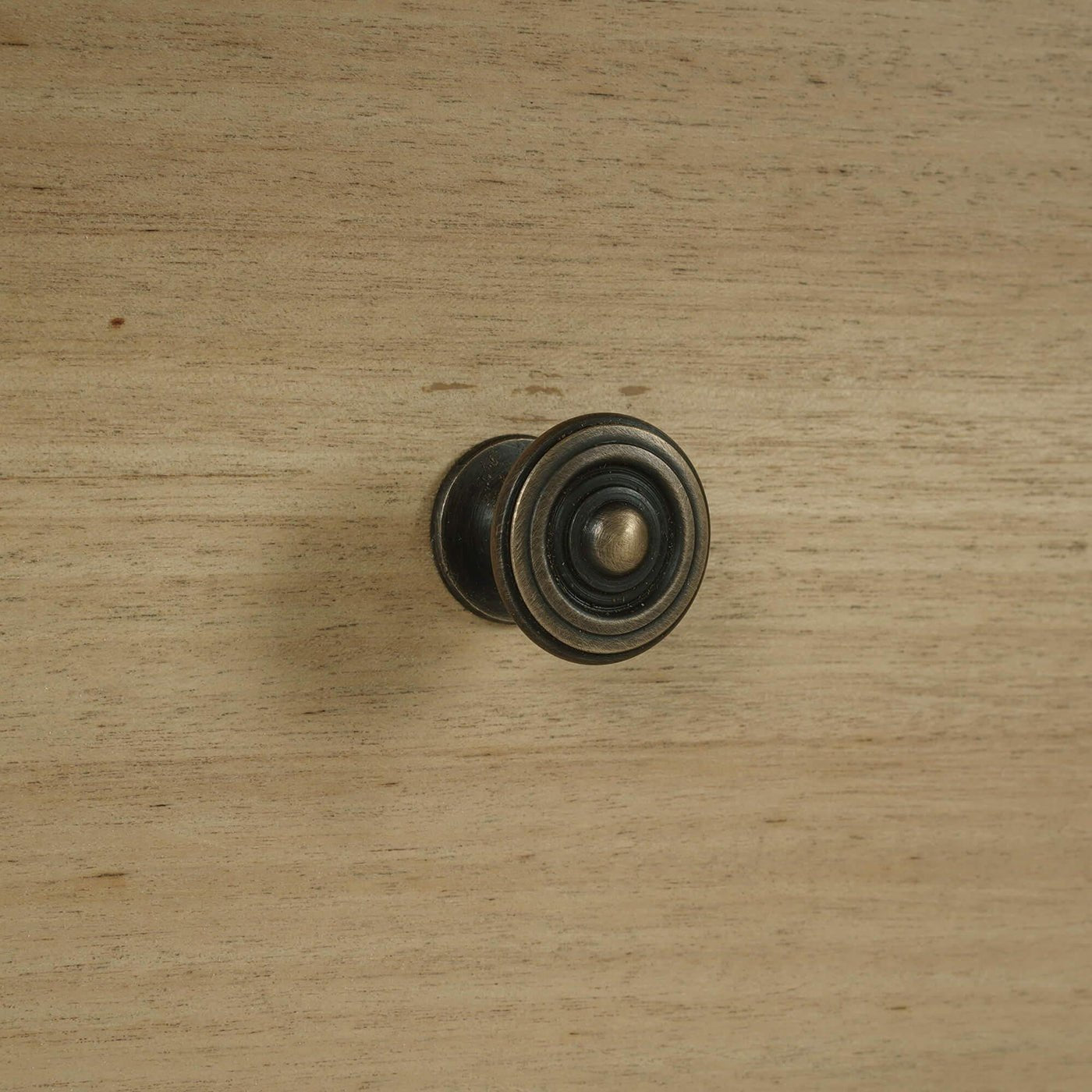 Detail of drawer knob on spool-turned nightstand.