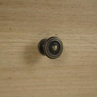 Detail of drawer knob on spool-turned nightstand.