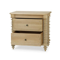 Open drawers of spool-turned nightstand.