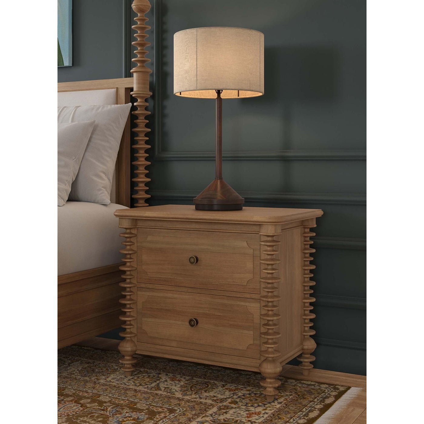 Spool-turned nightstand beside bed with lamp.