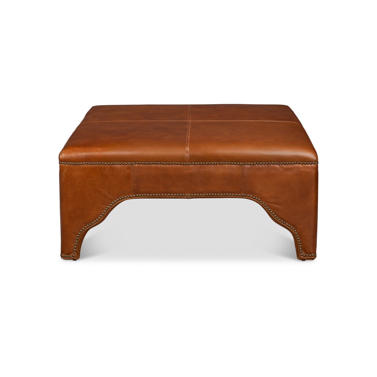 Square brown leather ottoman, front view, plain background.