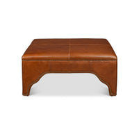 Square brown leather ottoman, front view, plain background.