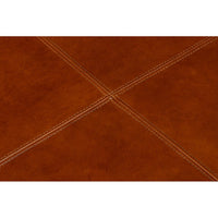 Detailed top stitching on brown leather ottoman.