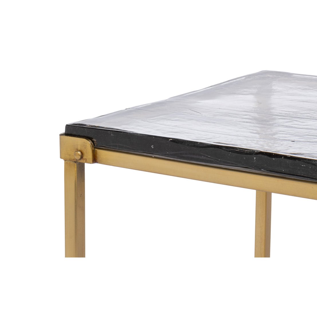 Edge detail of brass frame and glass top