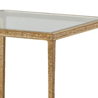Close-up of gold textured frame and glass top.