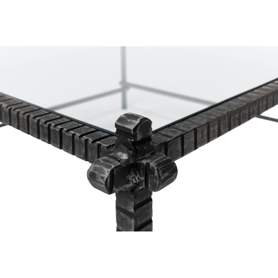 Corner detail, industrial metal joint, glass top focus.