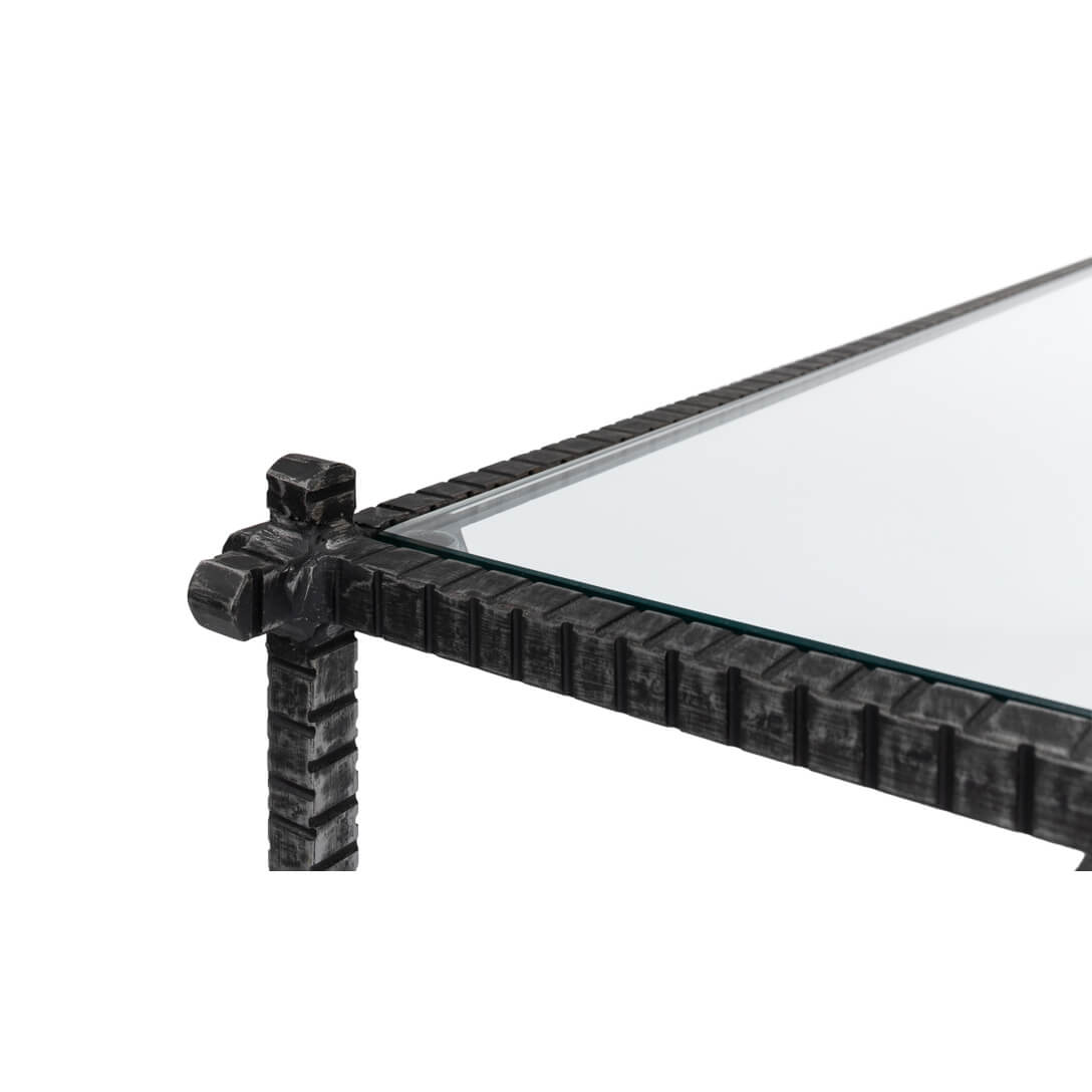 Detailed corner, metal frame, glass top surface.